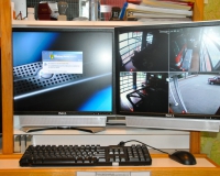 Central Dispatch Computer Server (Left) - Security Camera System Displaying Station 1 Apparatus Doors (Right)